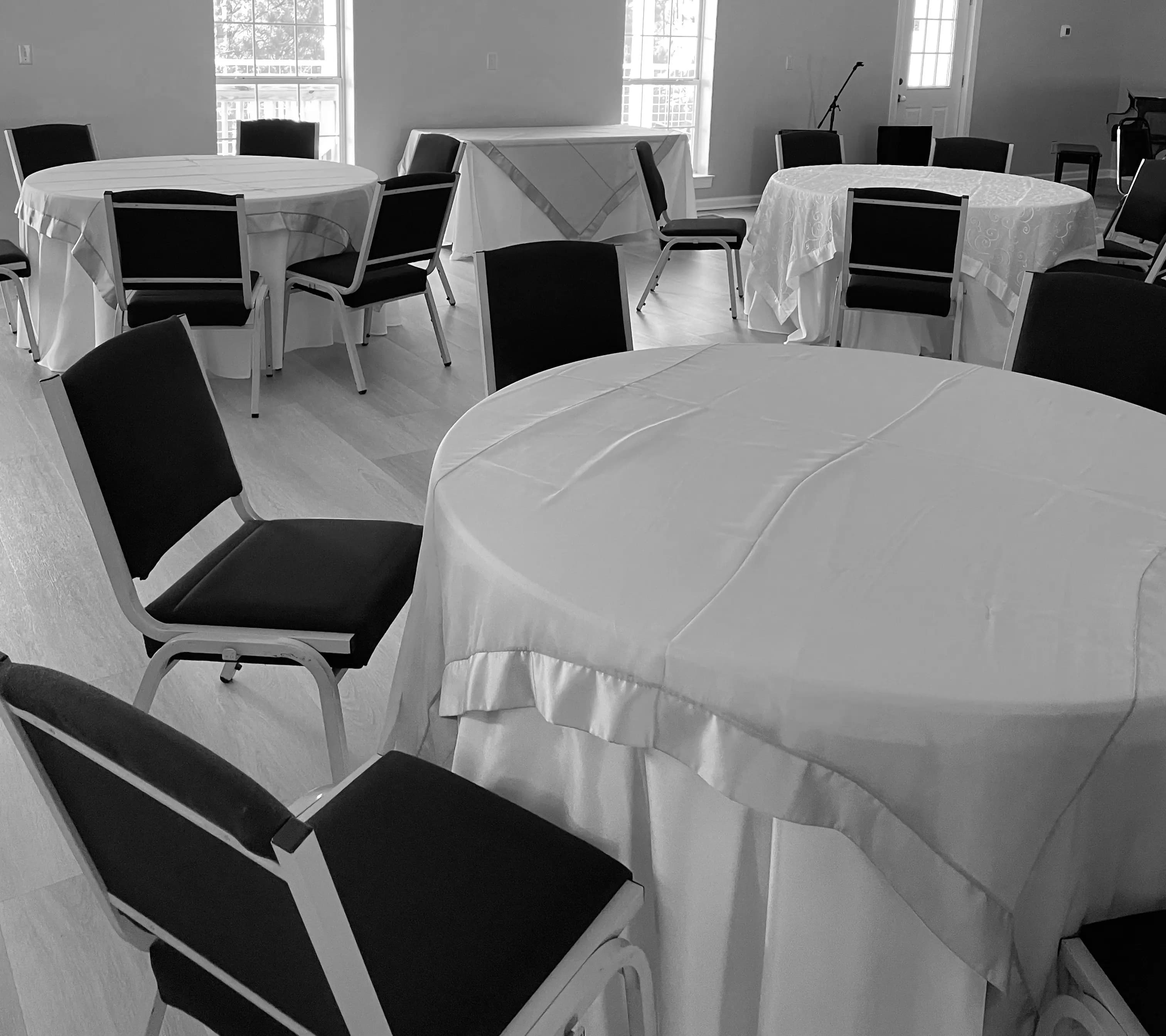 Corporate event setup with round tables and head table